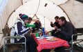 Guests tucking into fresh pancakes in the mess tent.
