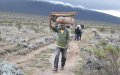Camping equipment like this wooden table is carried by the porters.